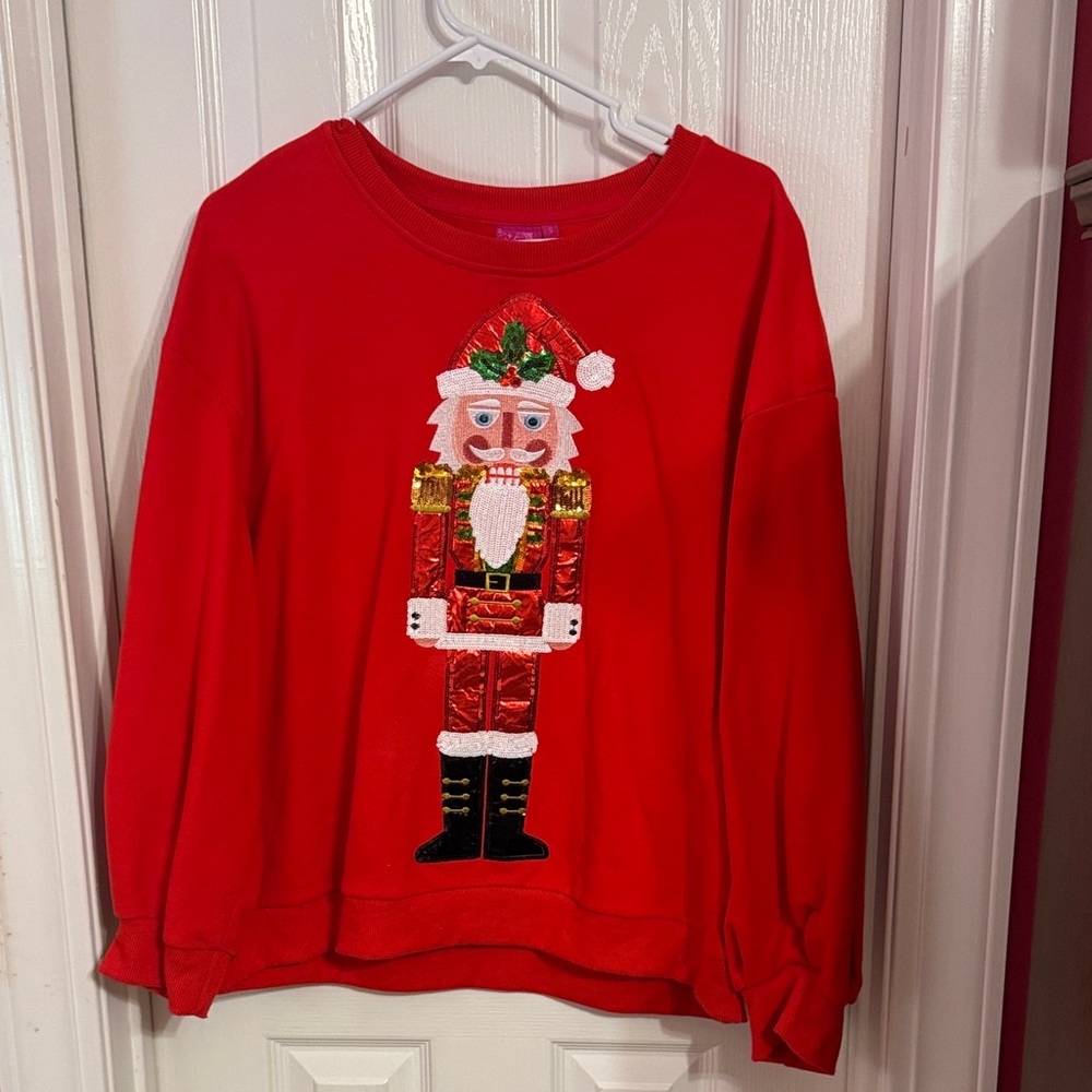 QOS Red Santa Nutcracker Sequin Holiday Sweatshirt